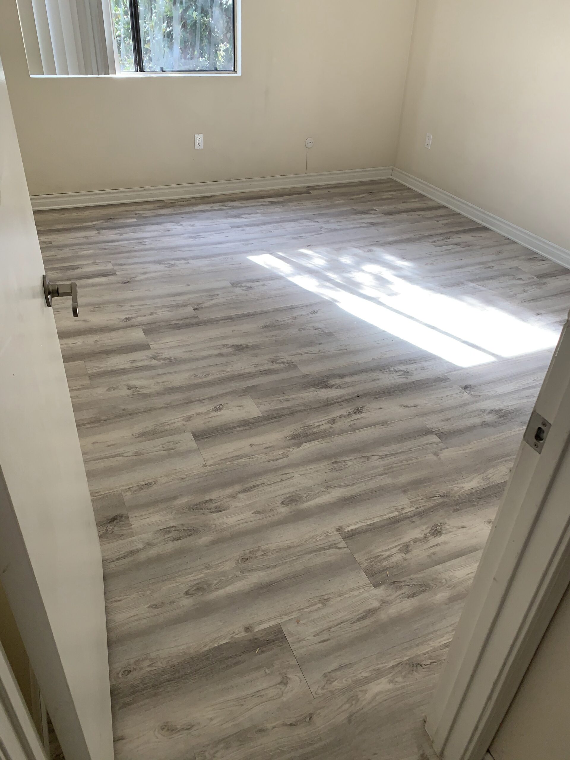 Skilled contractor planning Kitchen Remodeling in San Diego County - CA inside a bright home with layout drawings