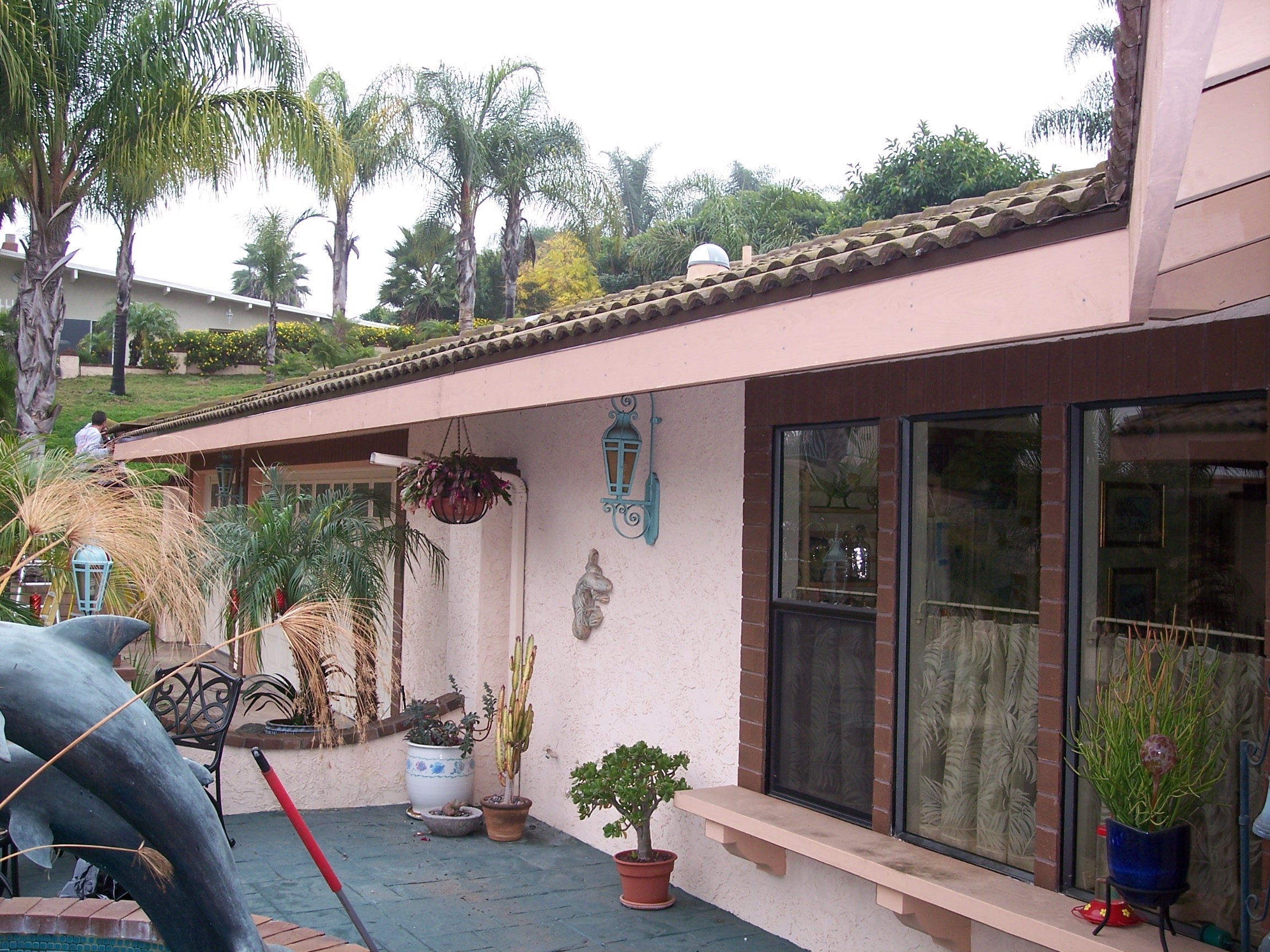 Kitchen Remodeling in Solana Beach - CA crew installing shaker cabinets beside a sunlit quartz island