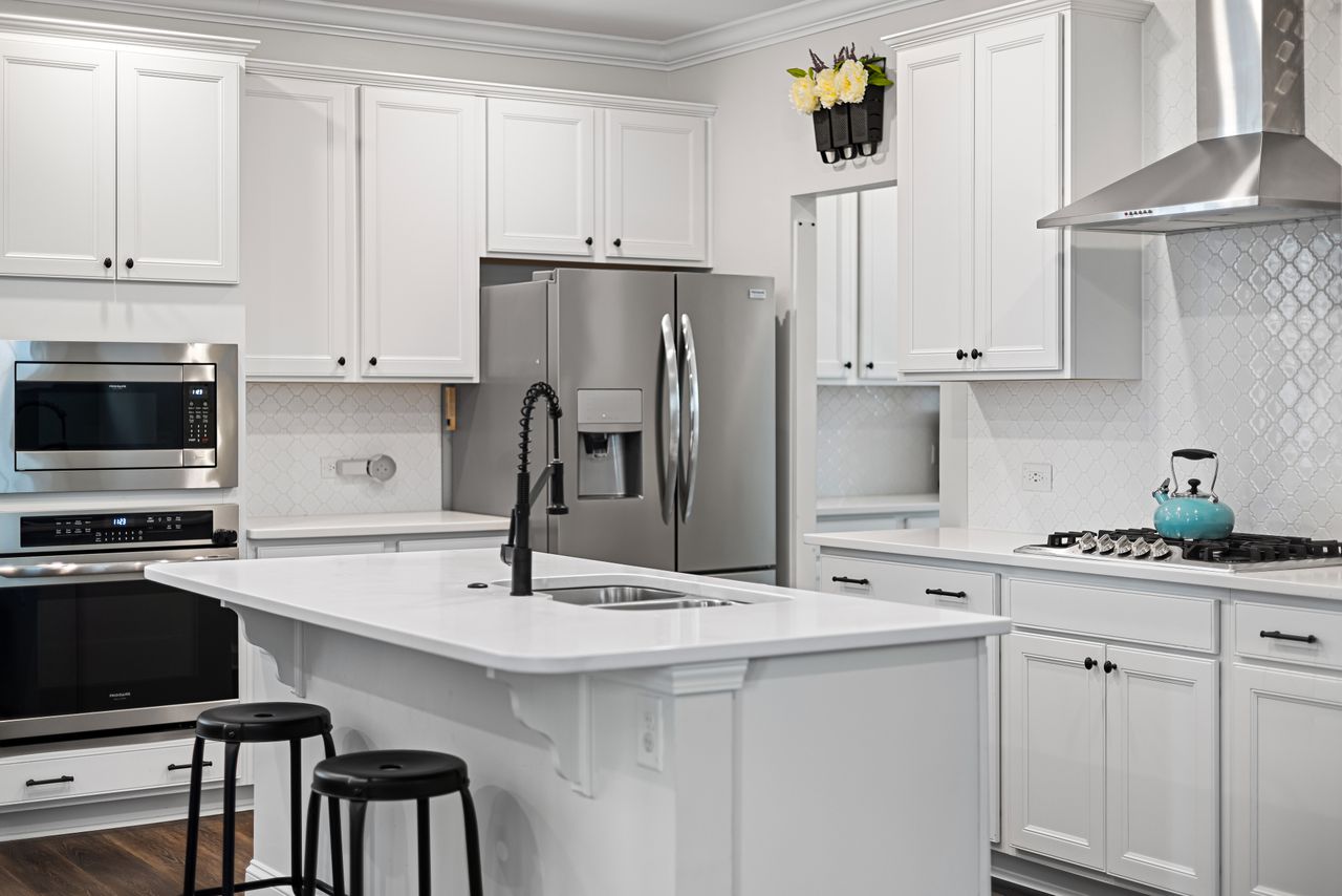 Contractor planning Kitchen Remodeling in Mira Mesa - CA while reviewing layout changes and appliance placement
